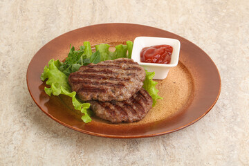 Grilled beef burger cutlet with sauce