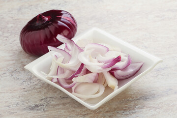 Sliced red onion in the bowl