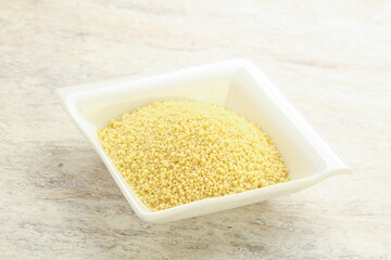 Raw couscous in the bowl