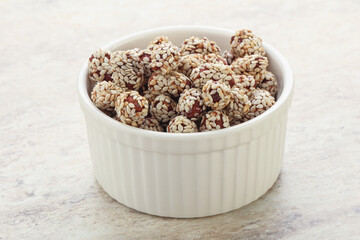 Sweet peanut in sesame seeds