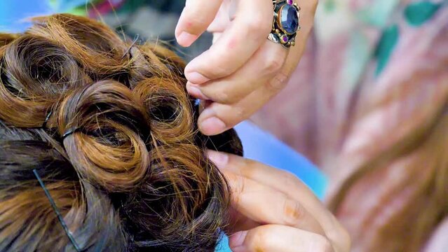 slow motion shot of applying hair makeup big close up