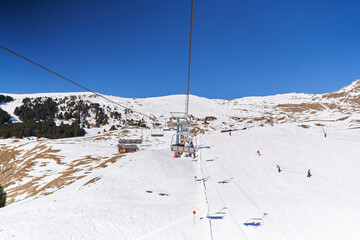 Fototapeta na wymiar View from Seceda Chairlift. Ski Slopes beneath lift. Beautiful Aerial Winter Landscape