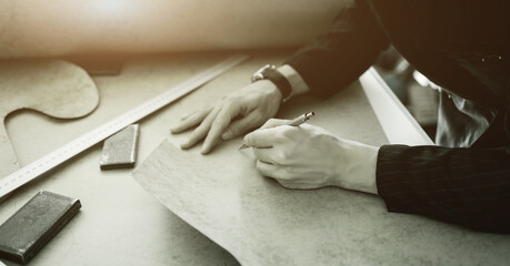 tailor working in atelier.