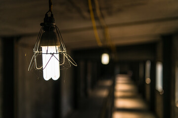 a light shining in a dark hallway