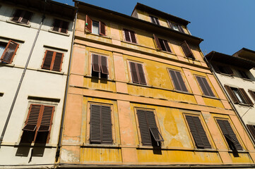 Obraz premium Facades with wooden window shutters in Florence, Italy