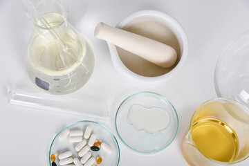Pills and scientific laboratory glassware, Medicine research and development concept.