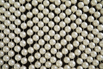 A string of pearls. Artificial garland of pearls. Interior design and decoration.