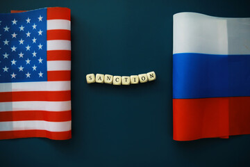 Background political. In the background are the American and Russian flags. US sanctions against...