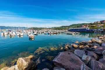 Lerici port with the ferry boat station to the Cinque Terre (ferry terminal) and many boats moored, small town and tourist resort on the coast of the Gulf of La Spezia, Liguria, Italy, Europe.

