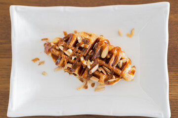 Caramel croffle and sprinkled with almonds