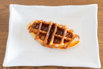 Caramel croffle  in white plate