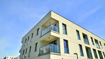 Apartment residential house and home facade architecture and outdoor facilities. Blue sky on the background. Sunlight in sunrise.