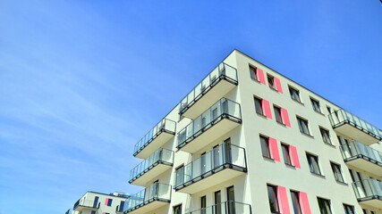 Apartment residential house and home facade architecture and outdoor facilities. Blue sky on the background. Sunlight in sunrise.