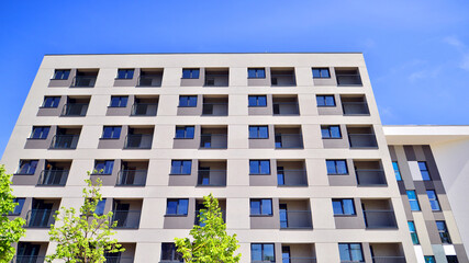 Fototapeta premium Apartment residential house and home facade architecture and outdoor facilities. Blue sky on the background. Sunlight in sunrise.