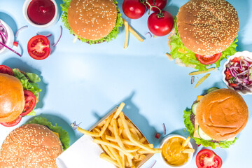 Various burgers set on blue background