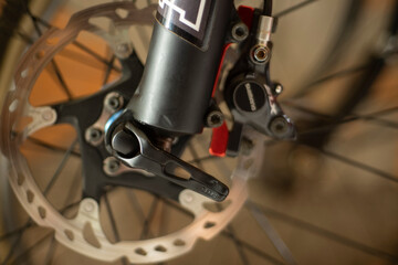 Close up of bicycle fork with quick release of wheel