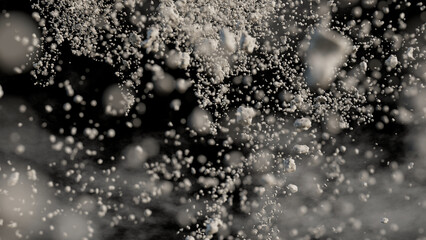 flying debris with dust on black background