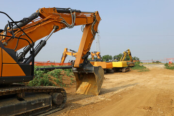 Group of heavy excavators at work in the countryside to install a natural gas pipeline