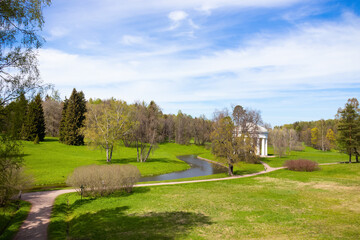 Fototapeta na wymiar Alcove among green landscape of Park on sunny day 