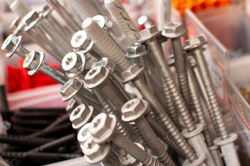 A handful of self-tapping screws. Construction abstraction. Industrial background.