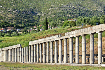 Fototapeta na wymiar Doric pillars at the ancient stadium of Messene (or Messini), an ancient Greek city rebuilt in 369 BC. The substantial ruins are a major attraction, much has been excavated and partly restored.