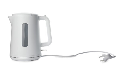 Modern electric kettle with base and plug isolated on white