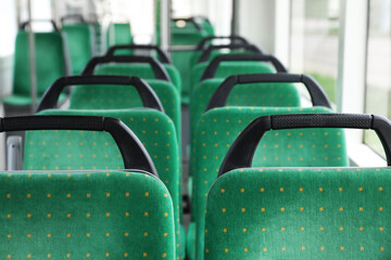 Obraz premium Rows of comfortable green seats in public transport