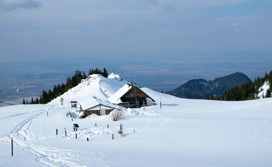 Chalet in the Piatra Mare Mountains , part of the Carpathian range in Romania , wintertime landscape