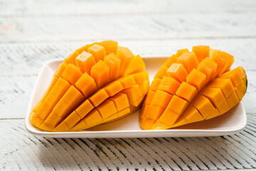 mango fruit,fresh yellow mango on white wood