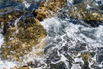 Top view, Sea ​​wave hitting rock on the beach.