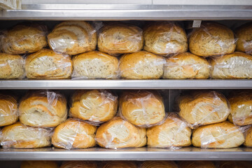 Many loaves and breads displayed at Brick Lane bakery Beigel Bake in London