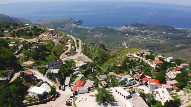 Pilur village on the Albanian Riviera in Himare, Vlore County. Aerial ascending view