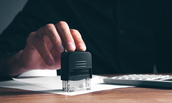 man leaves stamp on paper