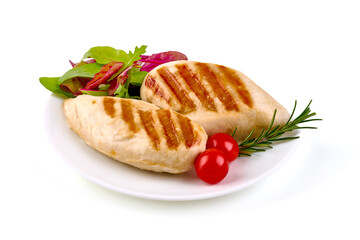 Chicken breast grilled meat, with vegetables and greens on a white plate, isolated on white...
