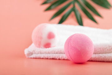 pink bath salt bomb on pink background with copy space