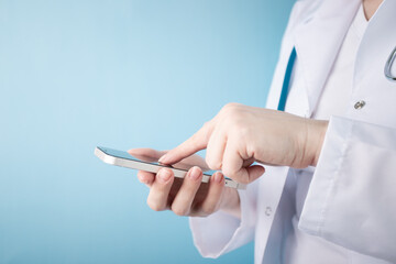 doctor touching the screen of the phone, medical technology, online medicine, consultations remotely in a medical clinic