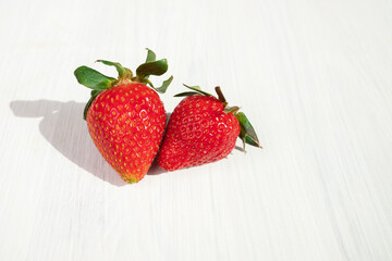 ripe strawberries on a white background on a farm on a wooden board,copy space
