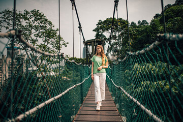 Girl on a suspension bridge in Kuala Lumpur Malaysia