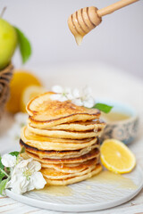 Pancakes with honey, lemon and apple