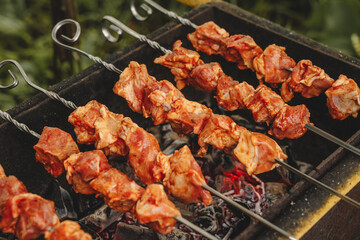Pork shish kebab cooked on the grill. Pieces of meat marinated in sauce.