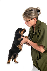 puppy rottweiler and woman