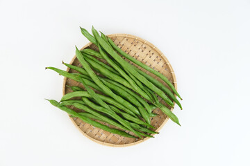 Buncis or Fresh raw string bean, legumes contain protein on white background.
