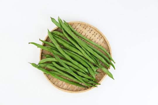 Buncis or Fresh raw string bean, legumes contain protein on white background.
