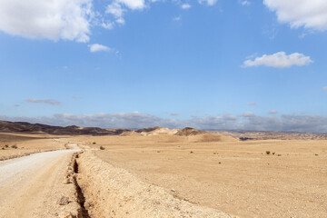 Road  through the stone desert near the Khatsatson stream, on the Israeli side of the Dead Sea, near Jerusalem in Israel