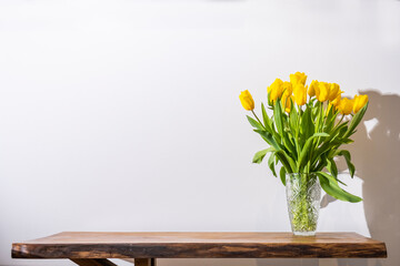 Yellow tulip flowers in vase. Space for text