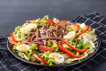 Salad with beef tongue and vegetables.