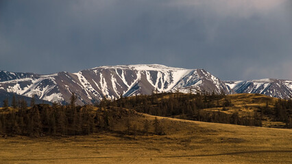 North Chuya Ridge. Evening sky with beautiful clouds. Kurai steppe. Altai Mountains, Russia