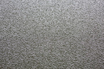 Water surface hit by raindrops