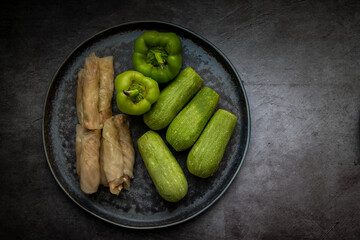 Different types of Mahashi or Dolma, cabbage rolls, stuffed peppers,Stuffed Zucchini, row before cooking.