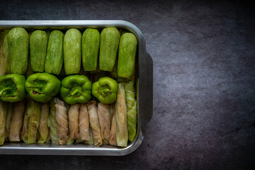 Different types of Mahashi or Dolma, cabbage rolls, stuffed peppers,Stuffed Zucchini, row before cooking.